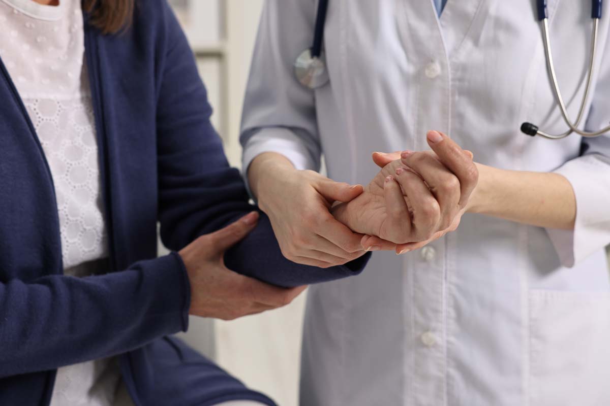 Dr. Susan Baker MD creating a personalized joint care plan to treat osteoarthritis at her Beverly Hills medical practice.