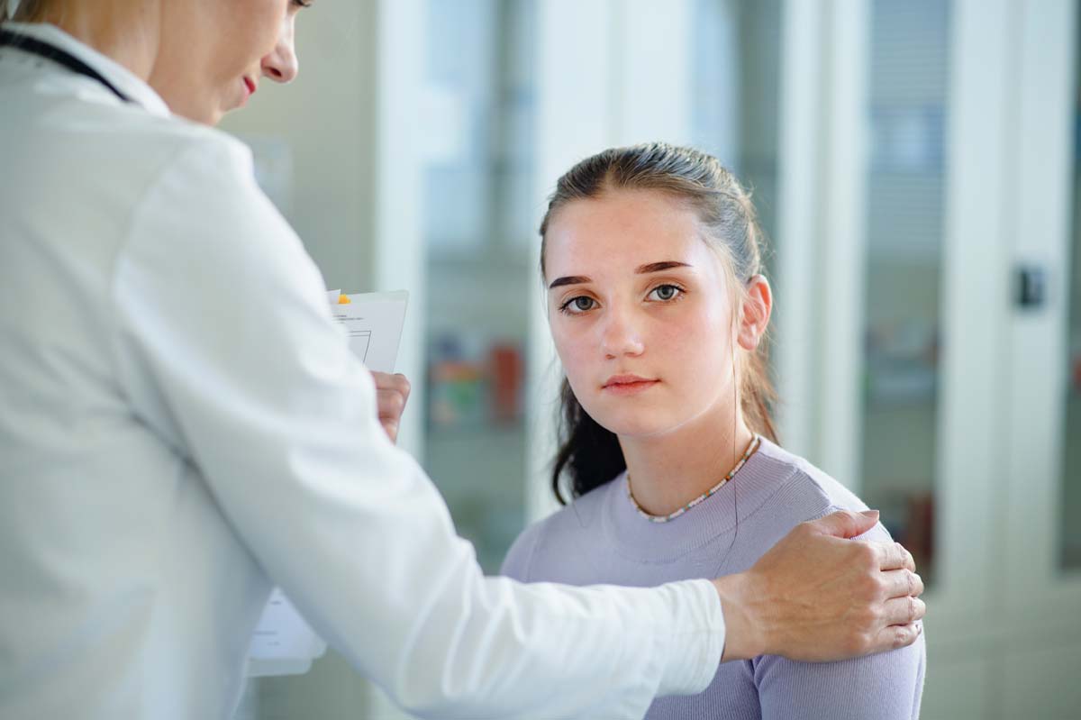 Dr. Susan Baker MD evaluating advanced biomarker diagnostics for juvenile spondyloarthritis at her Beverly Hills office.