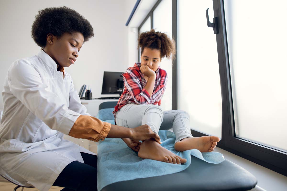 Staff member at Susan Baker MD discussing a personalized clinical care plan for fibromyalgia at the Beverly Hills medical practice.