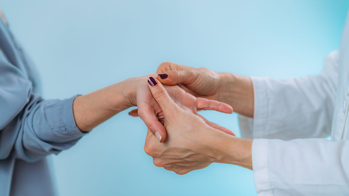 Doctor with Susan Baker MD evaluating advanced autoimmune symptoms to treat rheumatoid arthritis at the Beverly Hills medical practice.