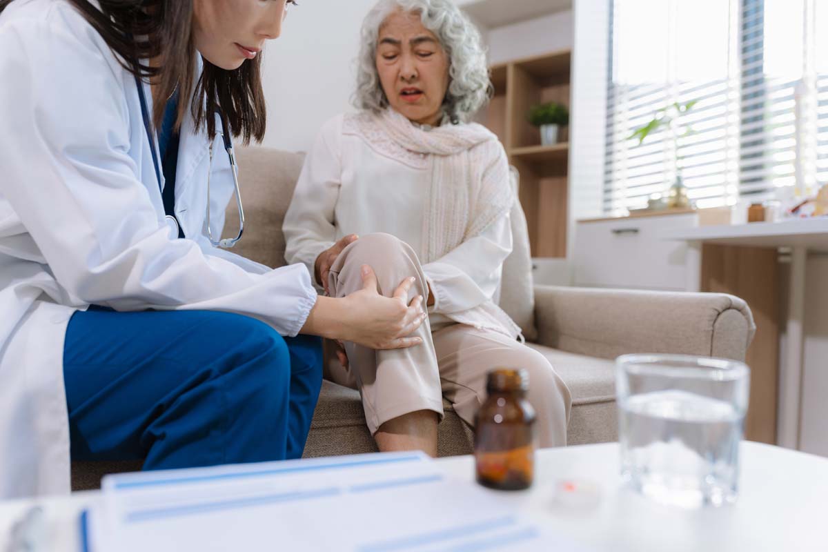 Dr. Susan Baker MD discussing personalized arthritis treatment options with a patient nearby her Beverly Hills office.