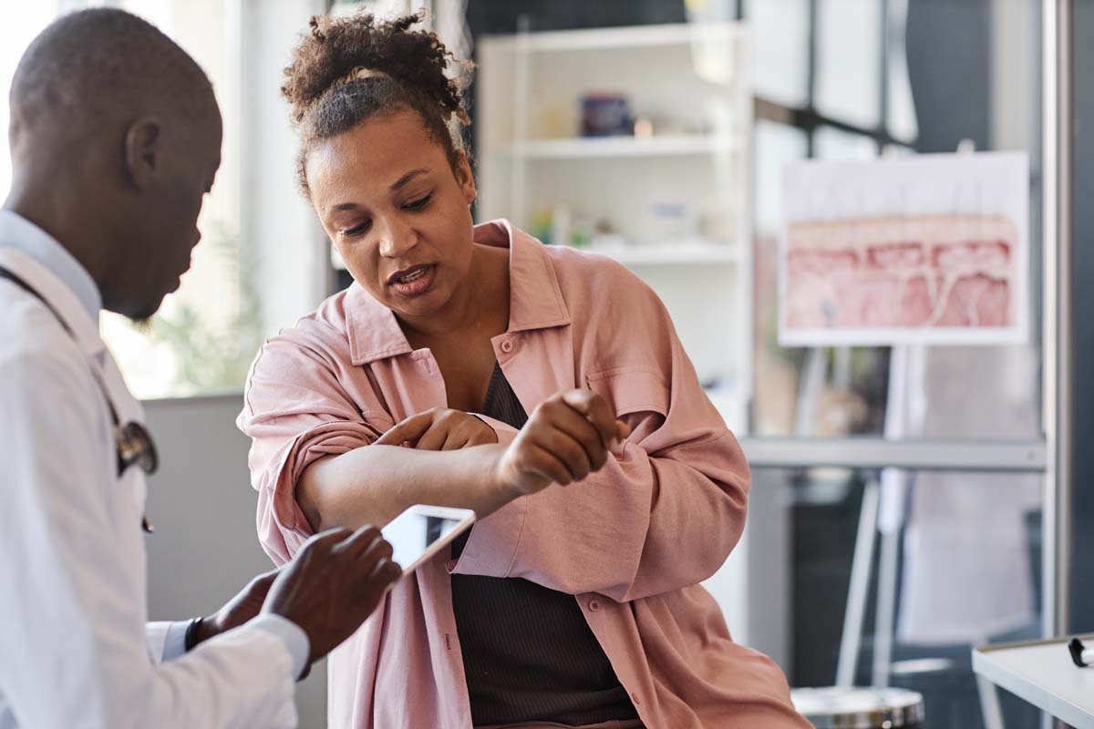 Doctor with Dr. Susan Baker MD evaluating connective tissue diagnostics to treat scleroderma at local Beverly Hills medical practice.