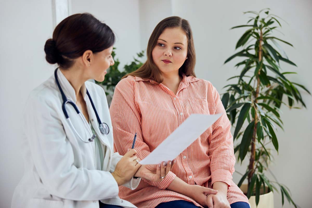Dr. Susan Baker MD analyzing advanced thyroid function tests to treat hypothyroidism at her Beverly Hills office.