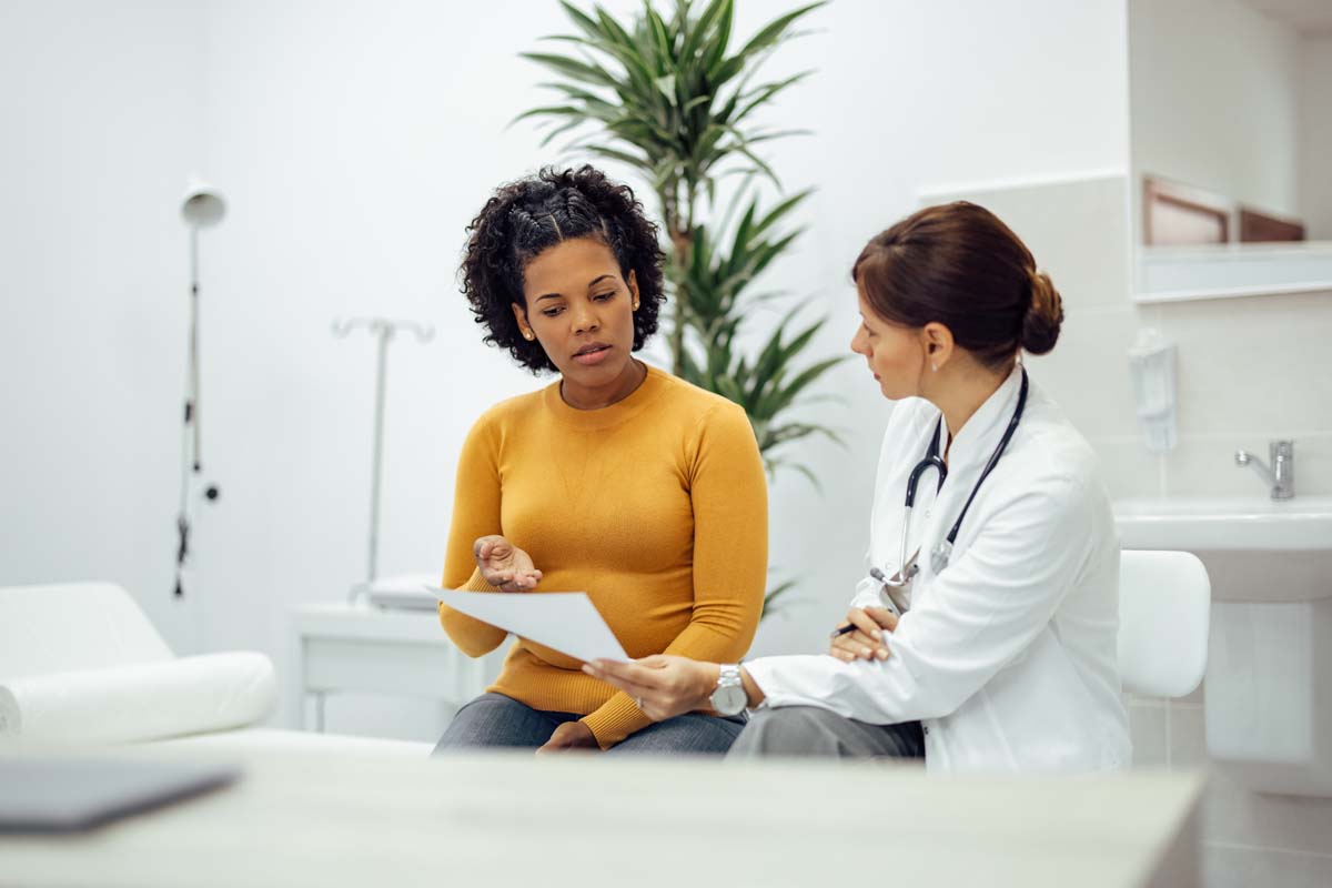 Dr. Susan Baker MD staff reviewing advanced connective tissue diagnostics to treat dermatomyositis at her Beverly Hills medical practice.